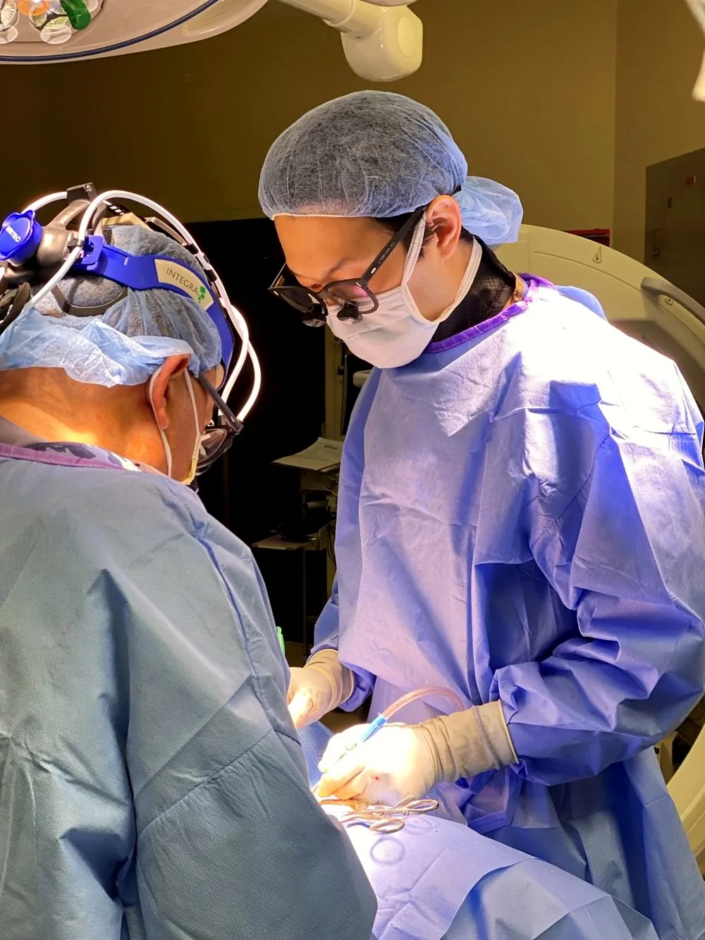 Dr. Choi performing surgery with surgical loupes