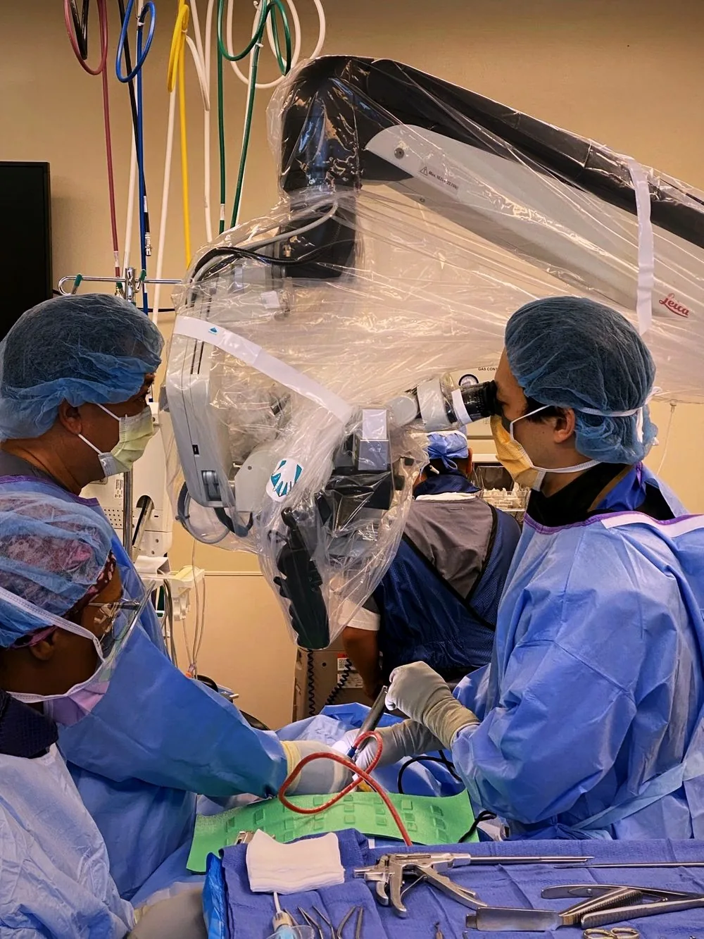 Dr. Choi operating with the surgical microscope